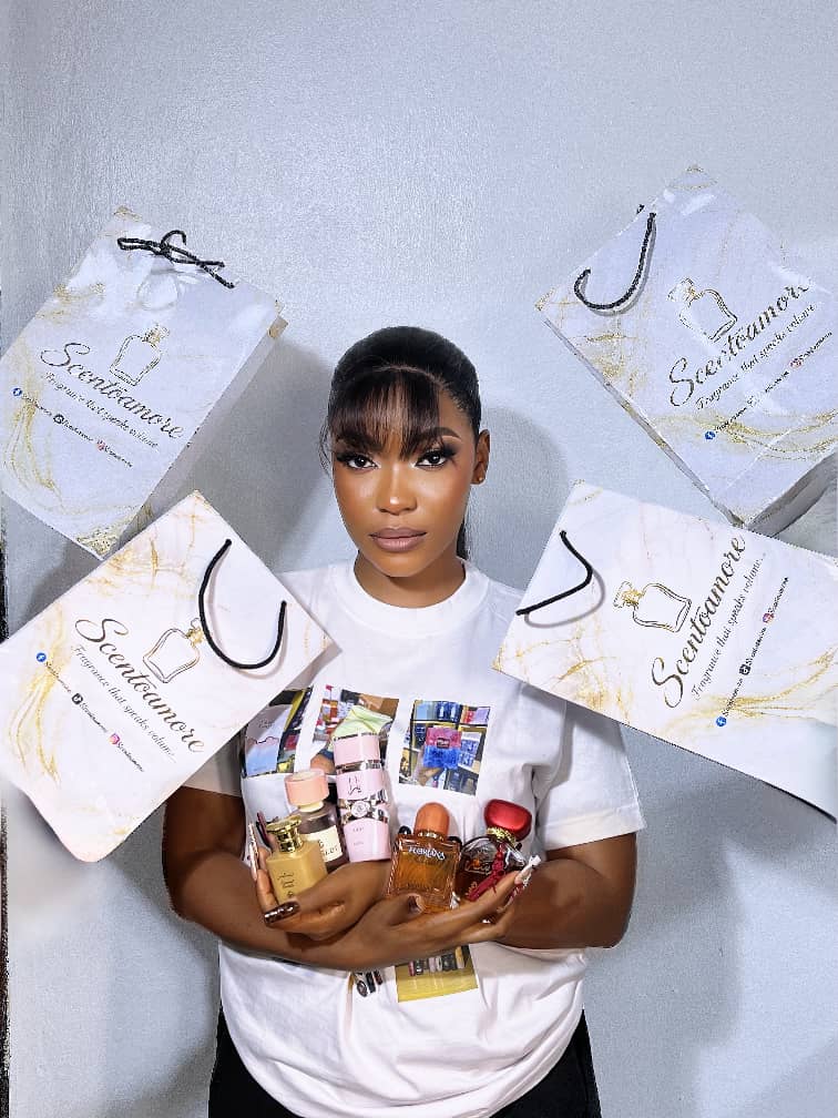 Scento Amore founder showcasing branded shopping bags